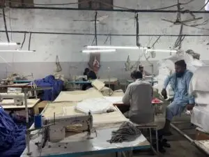 Busy Textile Workshop: Artisans at Work in a Fabric Production Unit